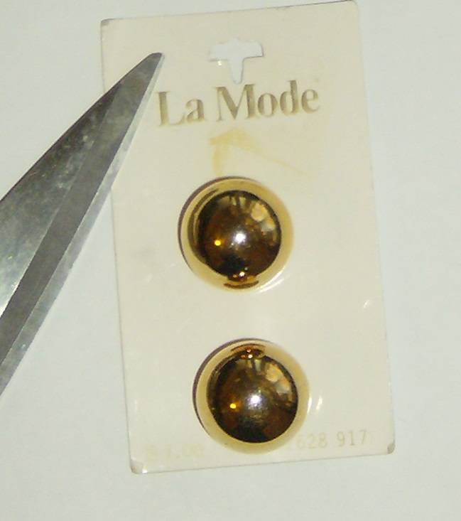 A card of shiny, old buttons. Photo by Holly Tierney-Bedord. All rights reserved.