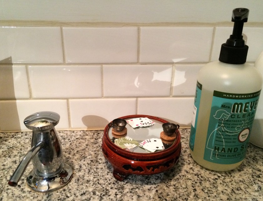 Cards and a cup o'grog. Photo by Holly Tierney-Bedord. All rights reserved.