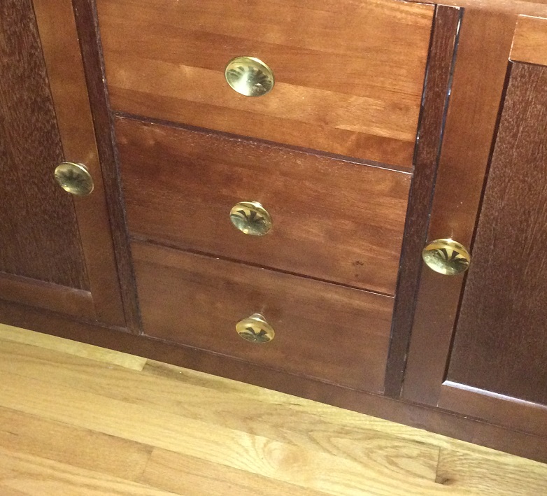 Brass mid-century knobs make a cabinet from Target unique. Photo by Holly Tierney-Bedord. All rights reserved.