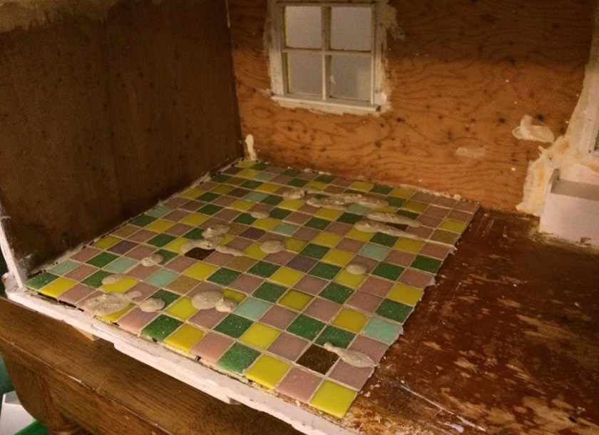 Almost done! Touching up the grout on the tile floors in my dollhouse. Photos by Holly Tierney-Bedord. All rights reserved.