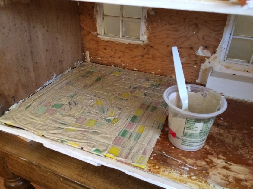 Installing tile floors in my dollhouse. Photo by Holly Tierney-Bedord. All rights reserved.