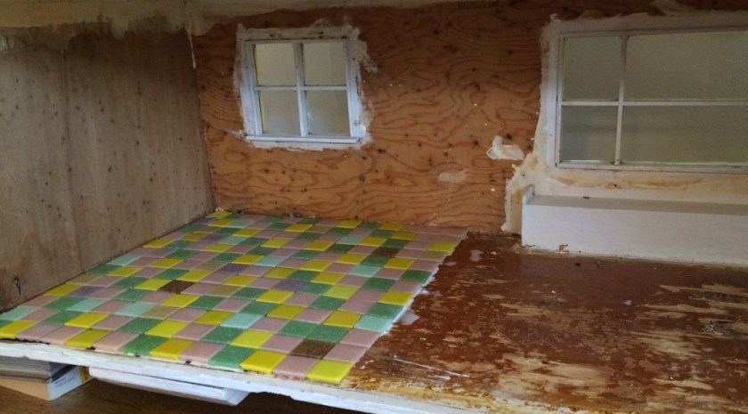 Installing kitchen tiles in my dollhouse. Photo by Holly Tierney-Bedord. All rights reserved.