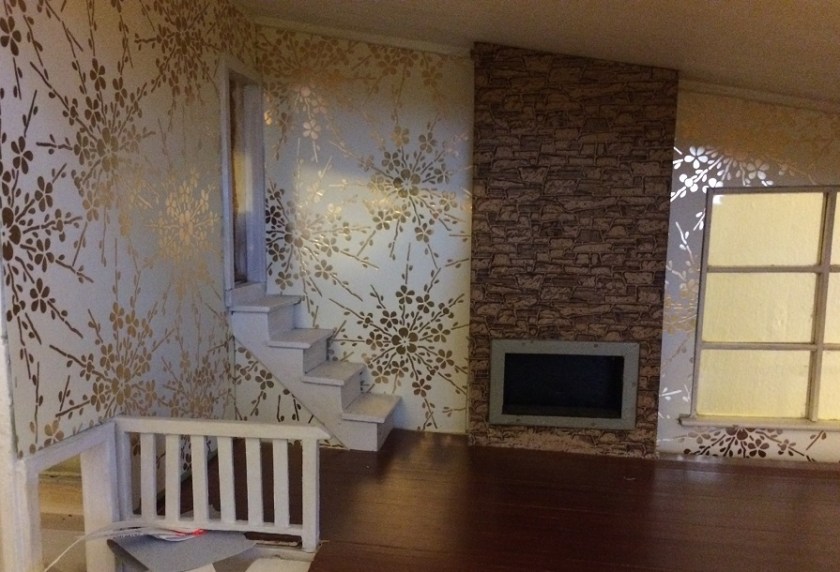 Installing wallpaper. Photo by Holly Tierney-Bedord. All rights reserved.