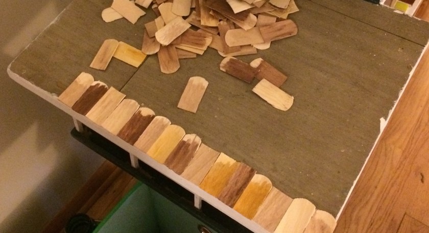 The first shingles going into place. Photo by Holly Tierney-Bedord. All rights reserved.