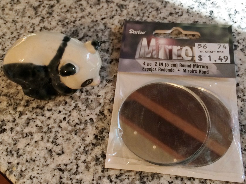 Panda figurine and some mirrors. Photo by Holly Tierney-Bedord. All rights reserved.