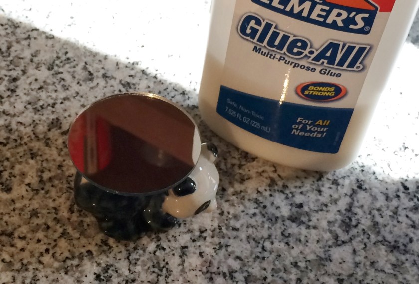 Panda figurine and some mirrors. Photo by Holly Tierney-Bedord. All rights reserved.