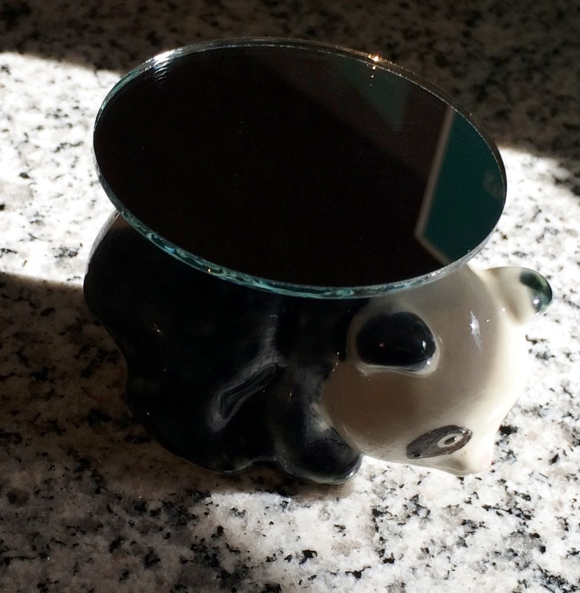 Panda figurine and some mirrors. Photo by Holly Tierney-Bedord. All rights reserved.