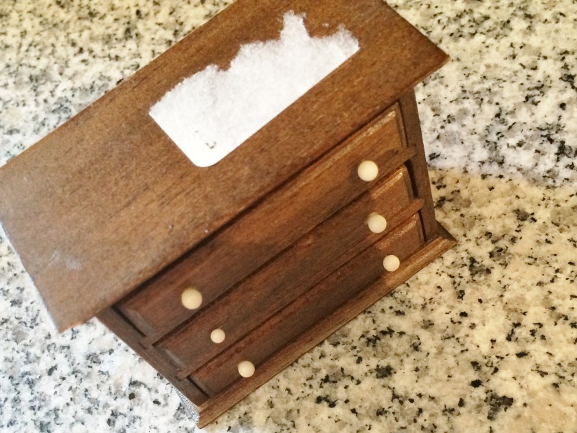 Goo-gone took care of this sticker without hurting the wood finish.